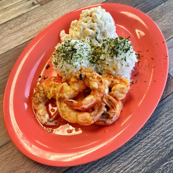 Grilled shrimp with rice and macaroni salad on a red oval plate from OverRice.
